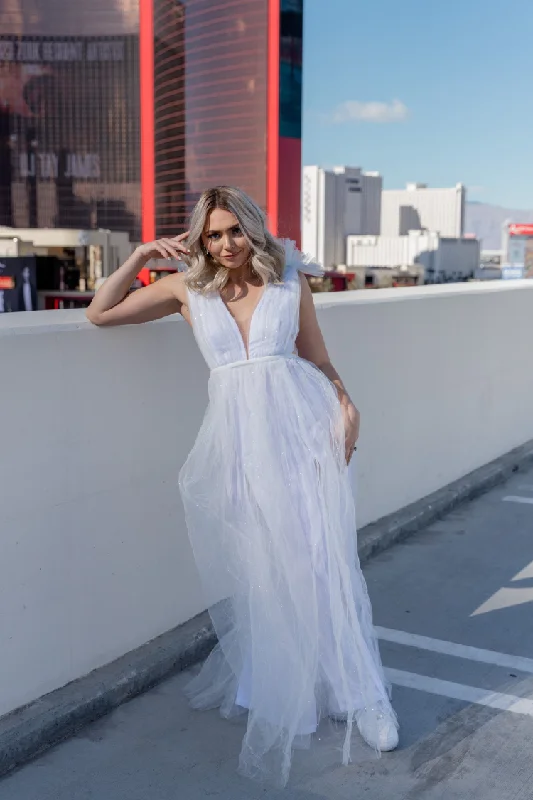 Printed Abstract Women Dress for a Modern and Artistic Appeal Printed Abstract Women Dress for a Modern and Artistic Appeal Alessia Tulle Deep V Gown - White