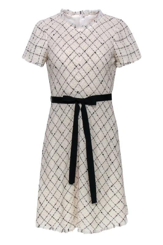 Ruffled Women Dress with Multiple Layers for a Playful and Girly Style Ruffled Women Dress with Multiple Layers for a Playful and Girly Style Rebecca Taylor - Cream & Black Tweed Diamond Print Fit & Flare Dress Sz XS