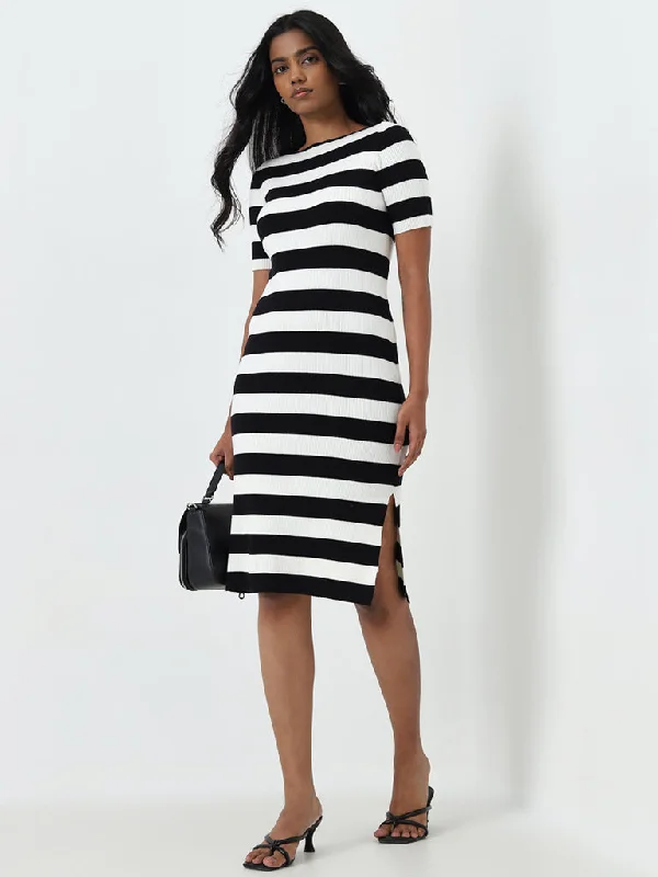 Midi dresses with ruffled sleeves for a more feminine and voluminous look Wardrobe Ivory & Black Ribbed Bodycon Dress Midi dresses with ruffled sleeves for a more feminine and voluminous look Wardrobe Ivory & Black Ribbed Bodycon Dress
