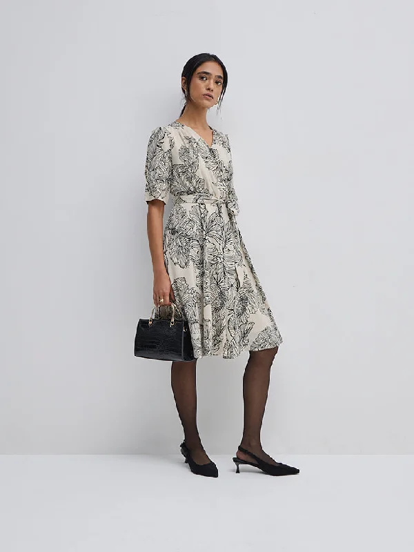 Midi dresses with pleated skirts for a timeless and elegant appeal Wardrobe Ivory Floral Design Wrap Dress with Belt Midi dresses with pleated skirts for a timeless and elegant appeal Wardrobe Ivory Floral Design Wrap Dress with Belt