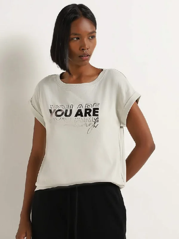 Women's designer brand pants High - rise flare women jeans for a 70s - inspired look Studiofit Grey Text Embossed Cotton T-Shirt Women's designer brand pants High - rise flare women jeans for a 70s - inspired look Studiofit Grey Text Embossed Cotton T-Shirt
