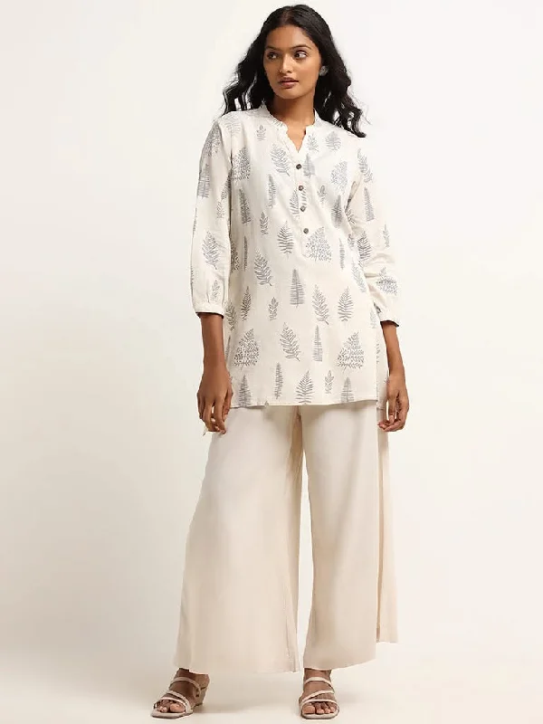 Women's tassel - adorned boho pants Embellished women jeans with studs or rhinestones for a glamorous touch Utsa Off-White Straight Fit Leaf Print Cotton Kurti Women's tassel - adorned boho pants Embellished women jeans with studs or rhinestones for a glamorous touch Utsa Off-White Straight Fit Leaf Print Cotton Kurti